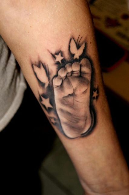 Baby footprint tattoo on the arm
