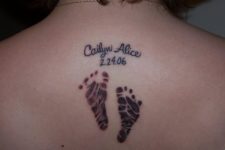 Baby footprint tattoo on the back