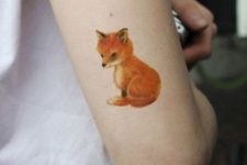Baby fox tattoo on the arm