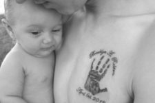 Baby handprint tattoo on the chest