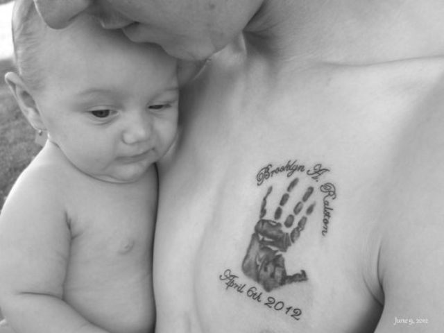 Baby handprint tattoo on the chest