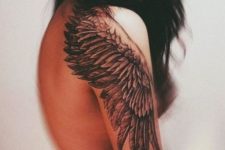 Big black wing tattoo