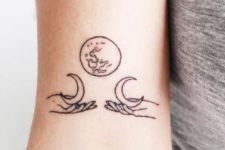 Black-contour moon tattoo