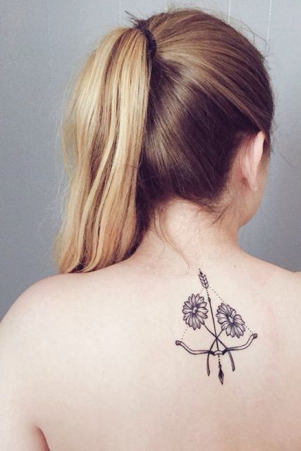 Black-contour tattoo on the back