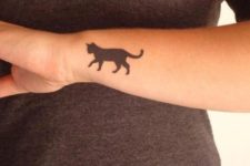 Black tattoo on the arm