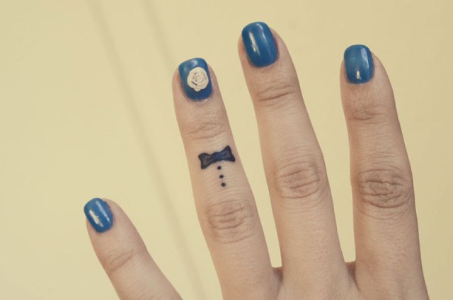 Black tattoo on the finger