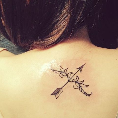 Chic bow and arrow tattoo on the back