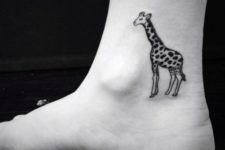 Classic giraffe tattoo on the ankle