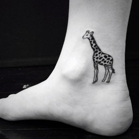 Classic giraffe tattoo on the ankle