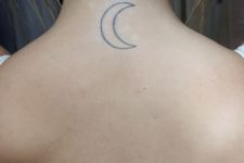 Classic moon tattoo on the neck