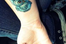 Colored owl on the wrist