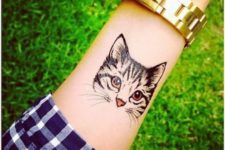 Cool cat tattoo on the arm