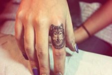 Cool wolf tattoo on the finger