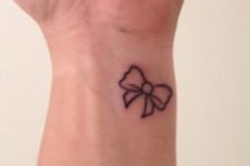 Cute bow tattoo on the wrist