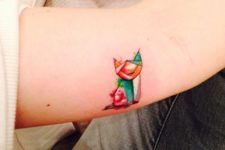 Cute cat tattoo on the arm