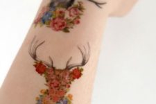 Floral deer tattoo on the arm