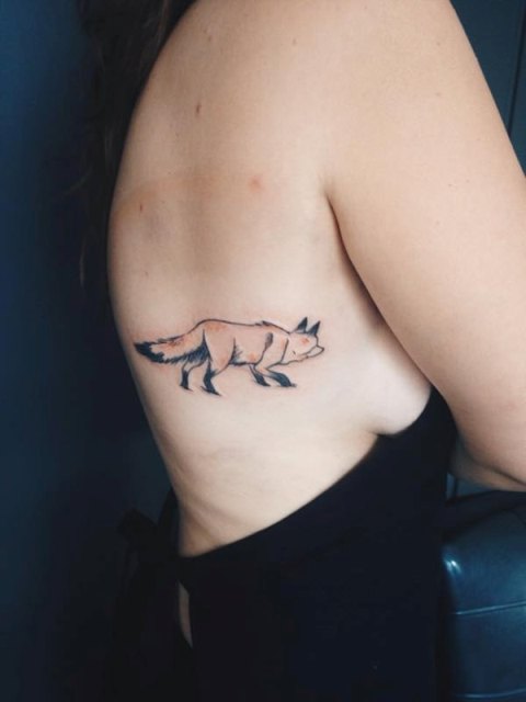 Fox tattoo on the right side