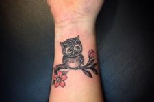 Owl with flowers tattoo