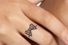 Polka dot bow tattoo