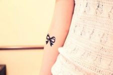 Silhouette bow tattoo on the arm