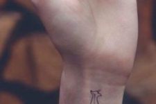 Simple tiny fox tattoo on the wrist