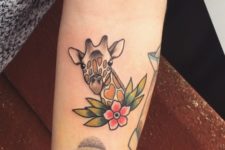 Small giraffe tattoo