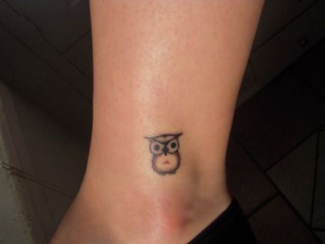 Small owl on the leg