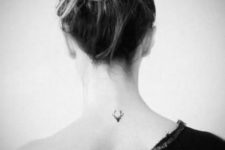 Tiny deer tattoo on the neck