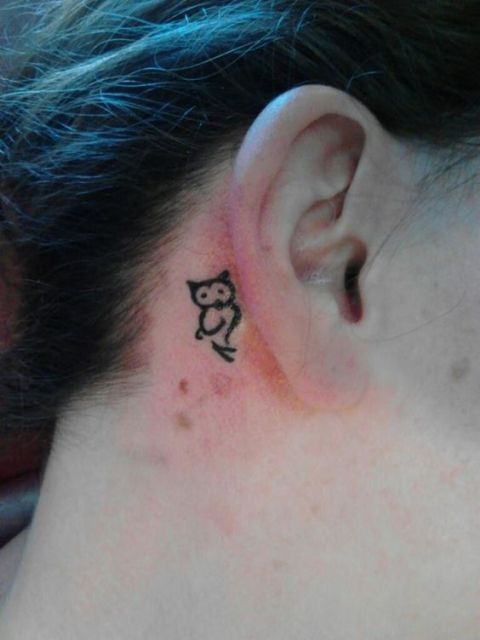 Tiny owl tattoo behind the ear