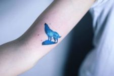 Tiny wolf tattoo on the arm