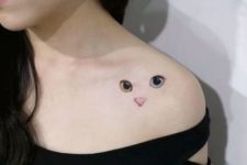 Unique cat tattoo on the shoulder