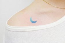 Watercolor moon tattoo on the shoulder