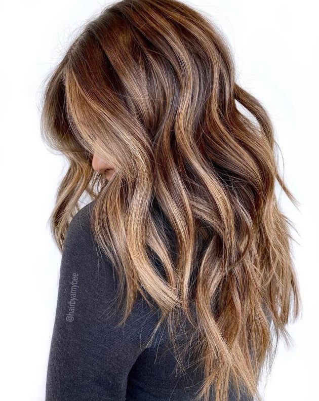 Brown hair with blonde and caramel highlights   blend several shades of caramel to achieve a 3D effect