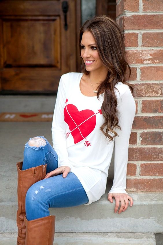 a heart long-sleeve top, jeans and high boots