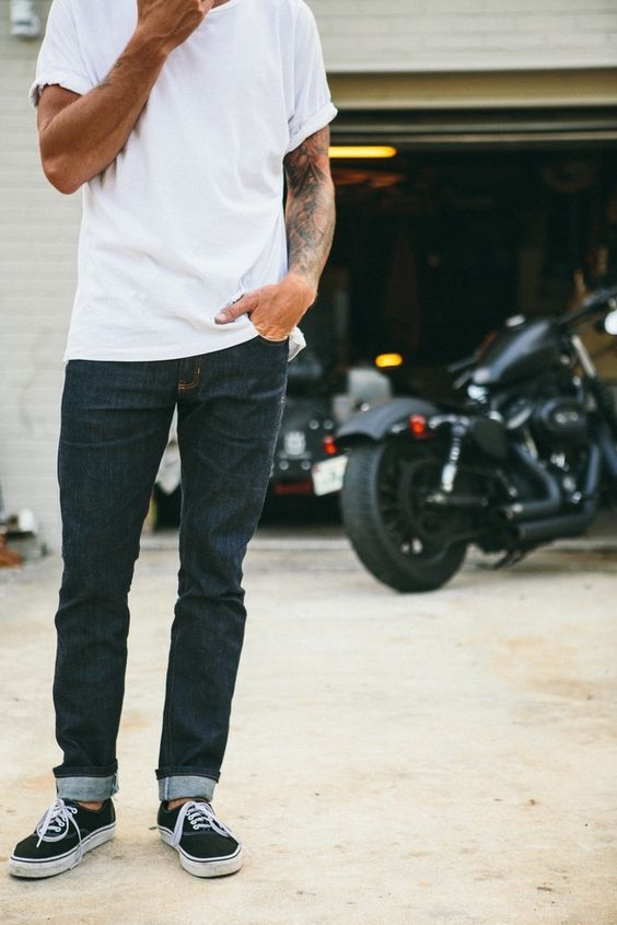 navy jeans, a white tee and black Vans