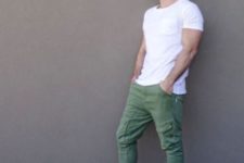 06 green sport pants, a white tee and black Converse