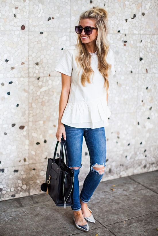white flare shirt, ripped blue jeans, silver flats and a black tote