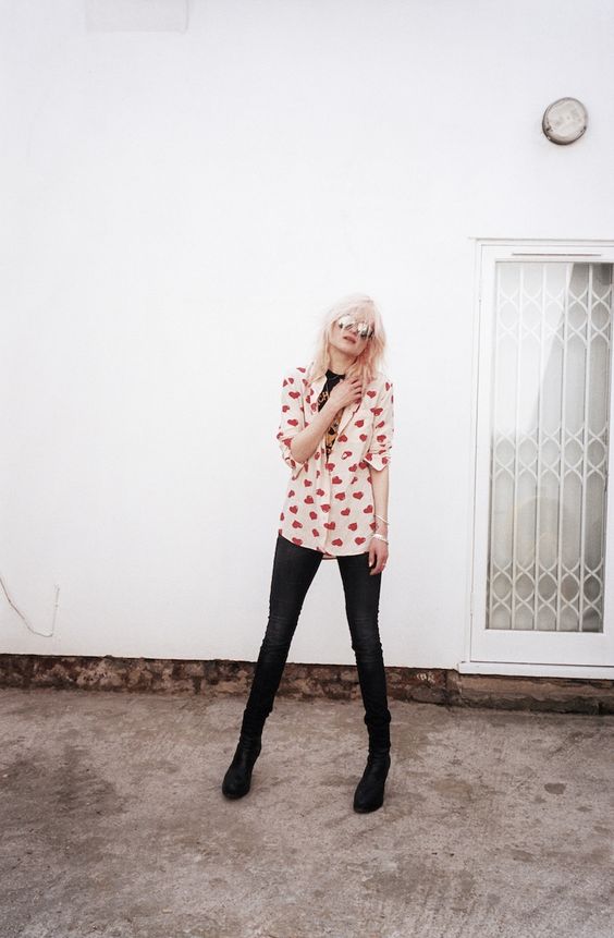 jeans, boots, a heart-print button up and a printed tee