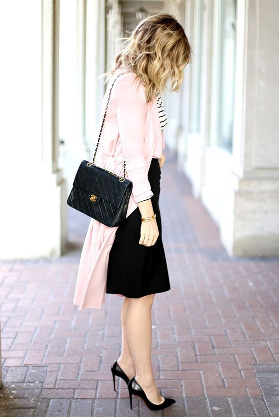 a light pink trench coat, a black and white striped top, a black pencil skirt, black heels