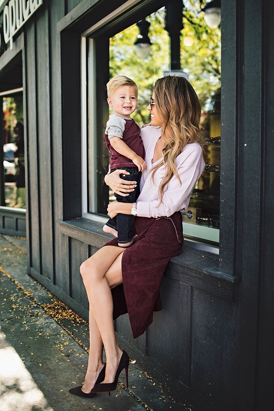 a burgundy tee and dark denim for the boy, a burgundy skirt and a blush shirt and suede shoes for the mom