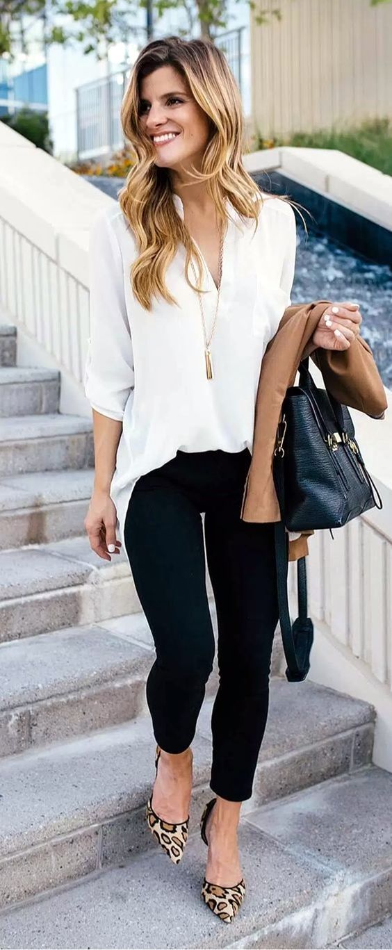 black jeans, a white shirt, leopard print heels and a tassel necklace