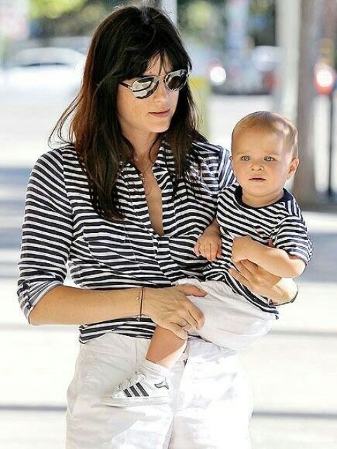 striped black and white tees and white pants for mom and her son