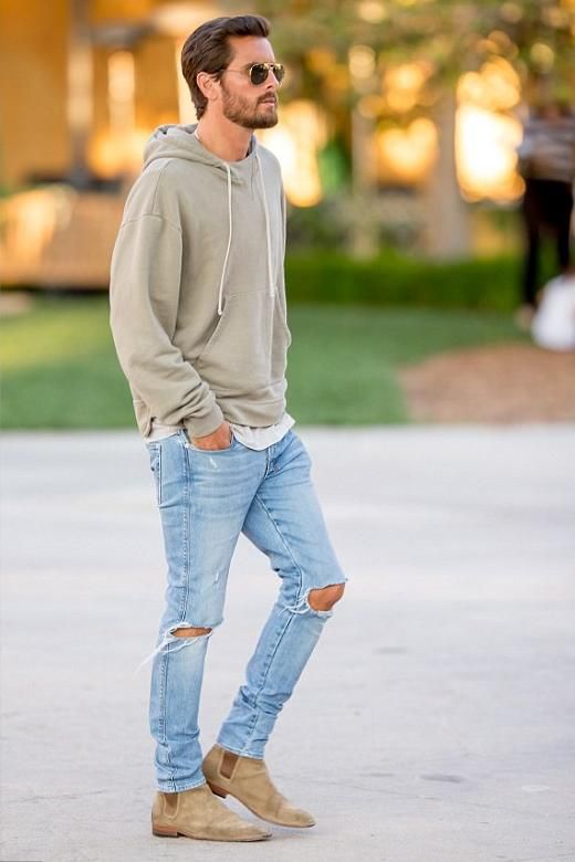 ripped blue jeans, a grey hoodie and beige suede boots