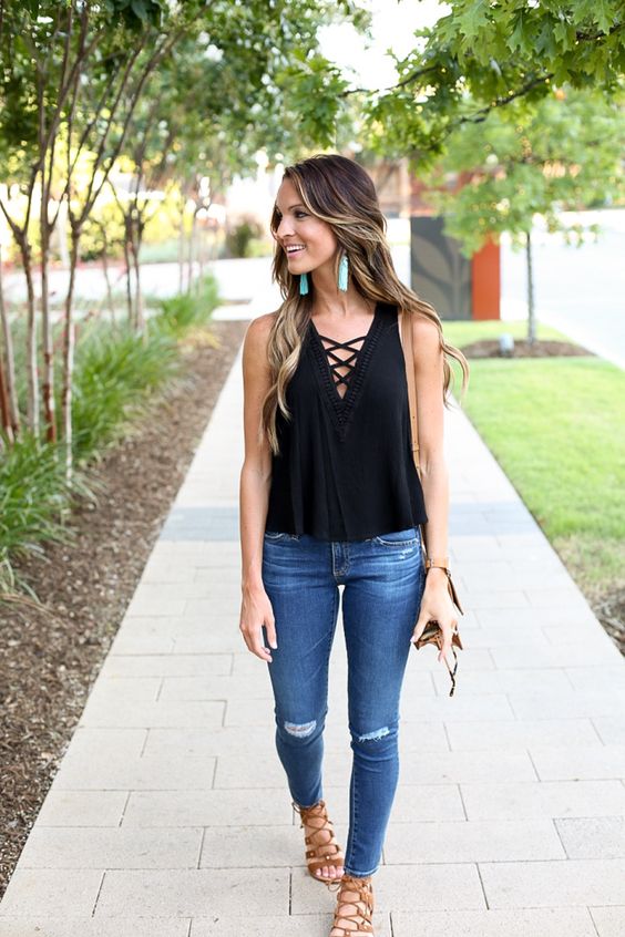 ripped denim, a black top and lace up sandals
