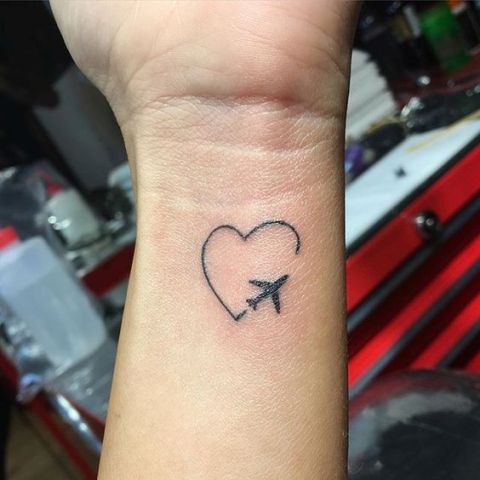 Airplane and heart tattoo