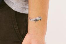 Airplane tattoo on the wrist