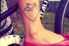 Bicycle and heart tattoo on the leg