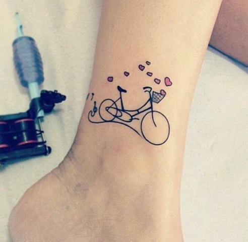 Bicycle and hearts tattoo