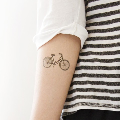 Black bicycle tattoo