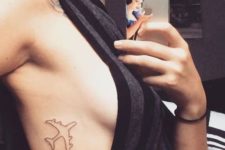 Black-contour airplane tattoo on the side